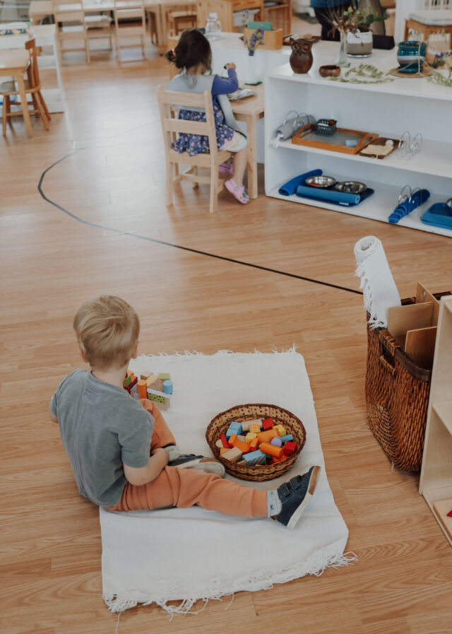 Building with blocks on a work mat