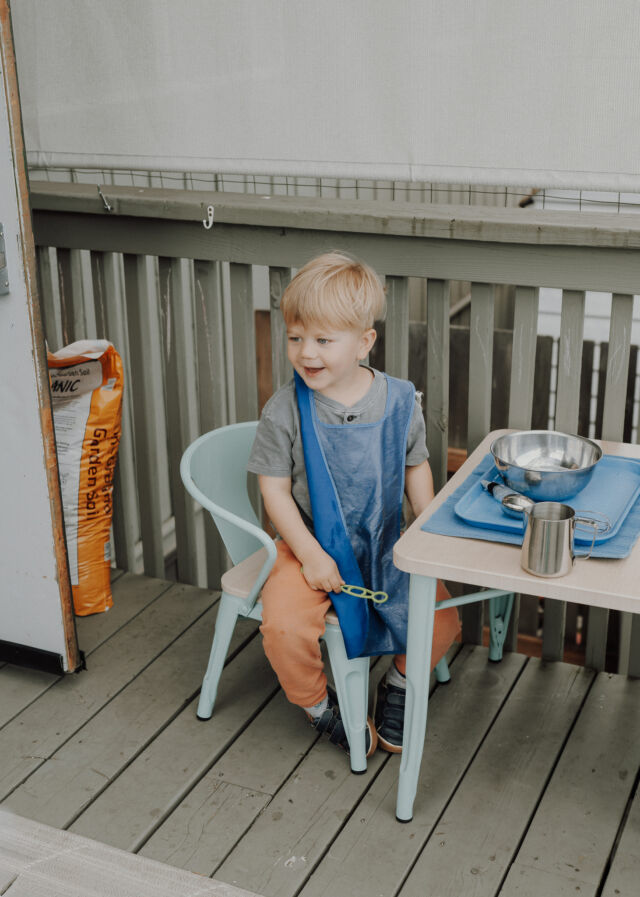 Laughing over water work on the outdoor deck