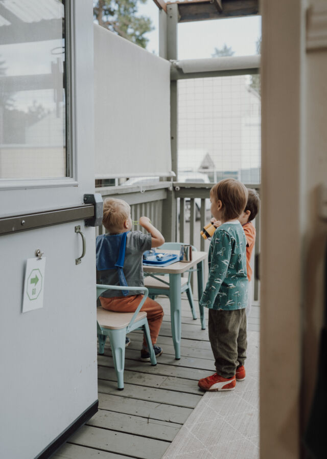 Two toddlers side by side on the deck