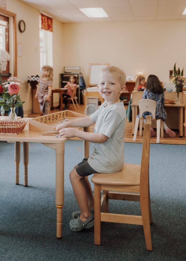 A game of checkers at the classroom table