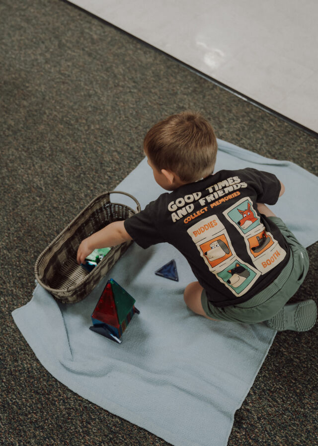 Card work on the classroom rug