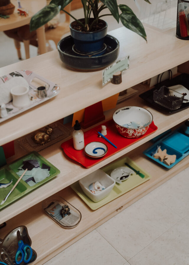 Prepared trays on the classroom shelf
