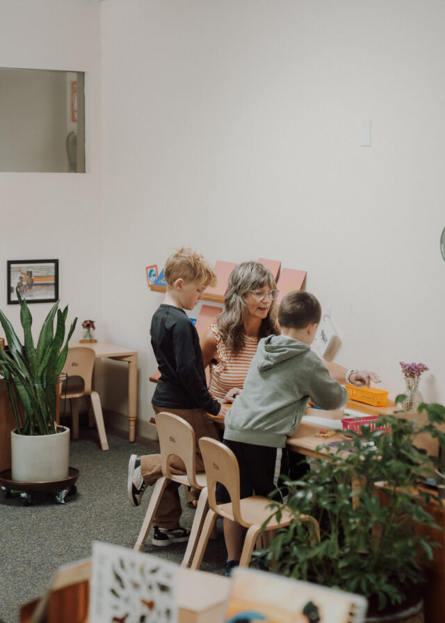 A guide joins work at the plant table