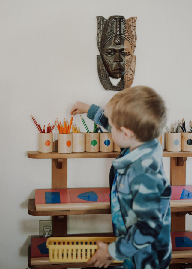 Choosing colored pencils from the shelf