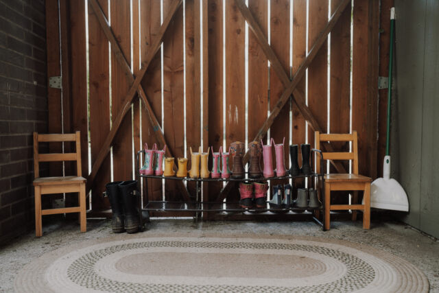 Rain boots lined up at the door