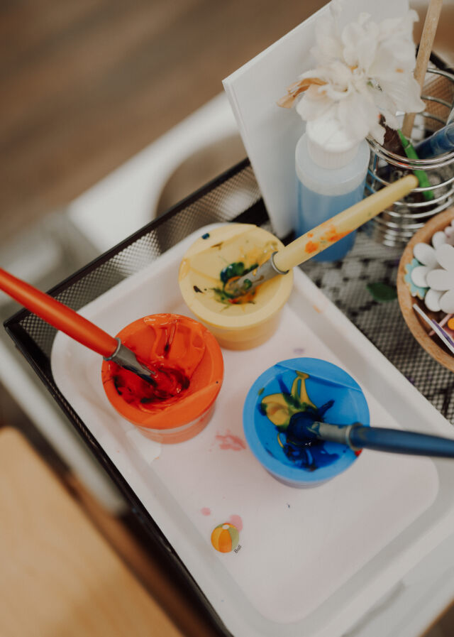Paint pots and brushes ready for art