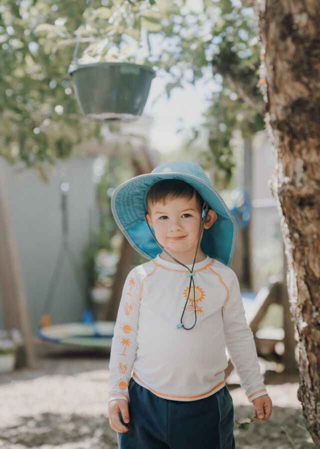 A sun-hatted friend in the garden