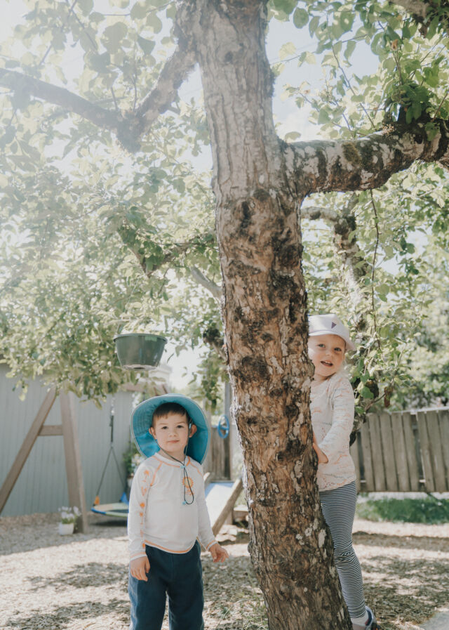 Under the apple trees in the play yard