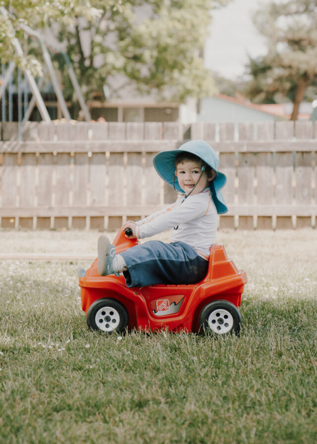 Cruising the lawn on a ride-on car