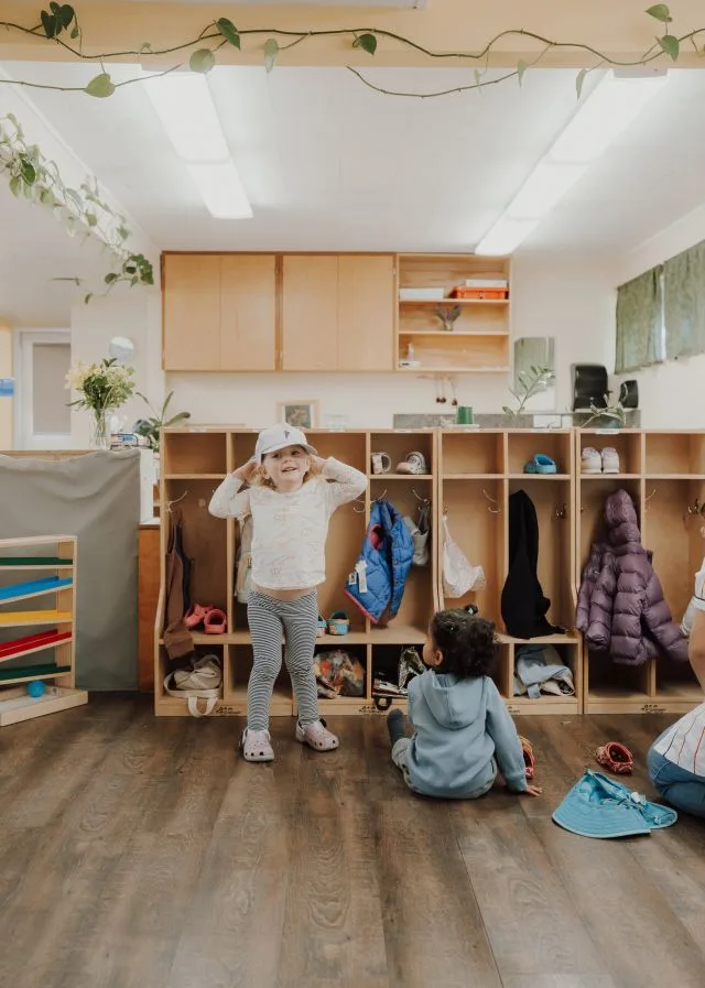 Children getting ready at the coat cubbies