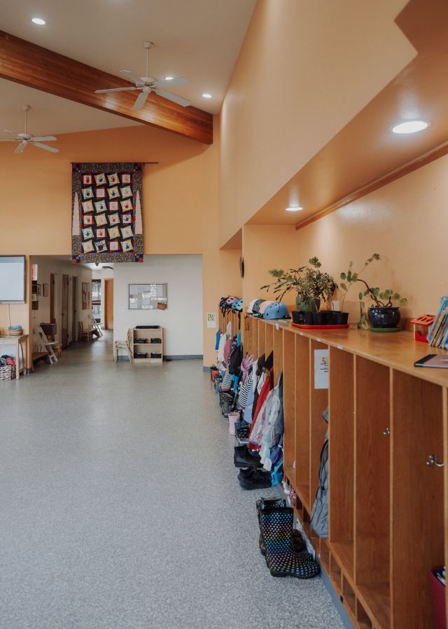 The entry hallway, with the community handprint quilt on the far wall
